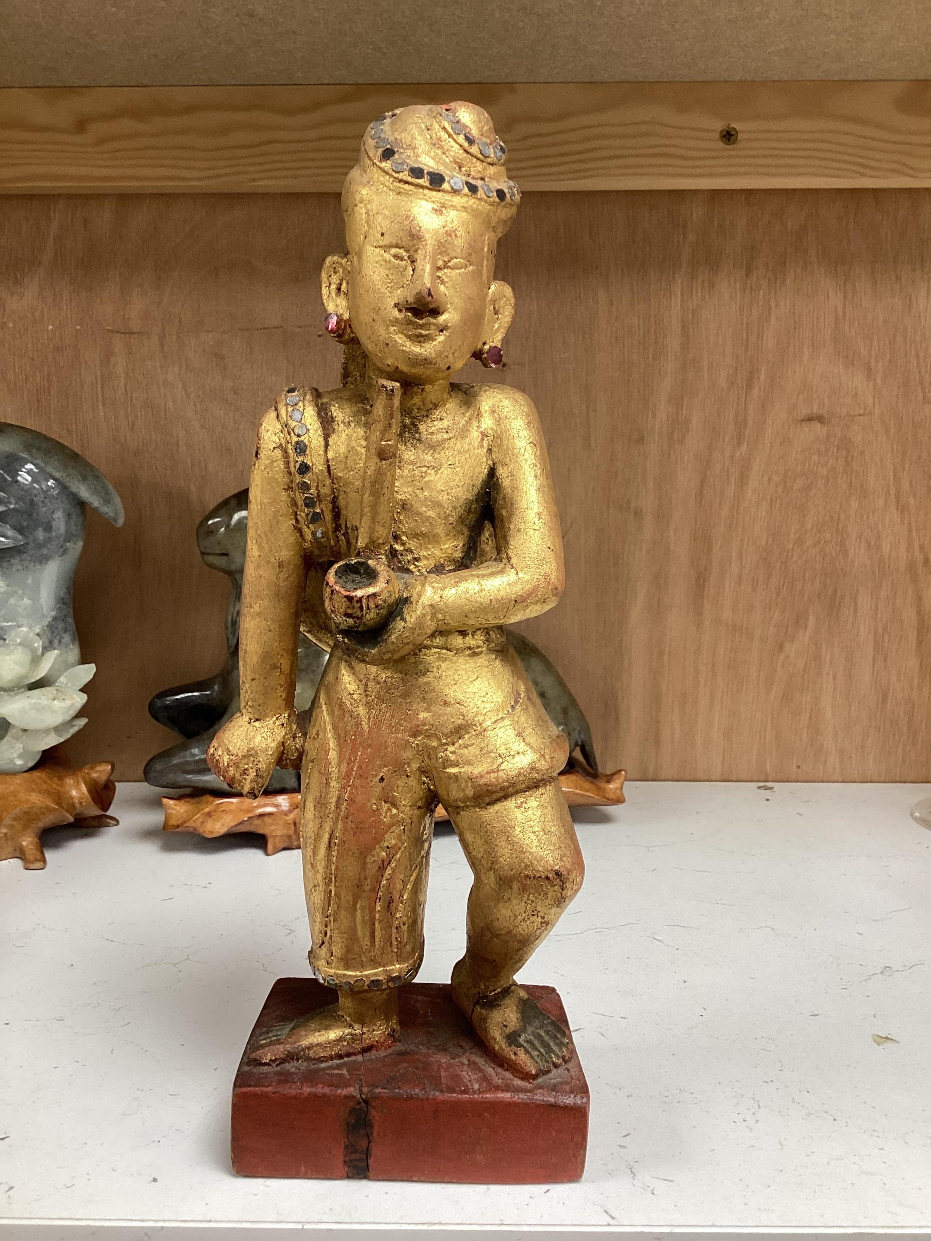 Two modern jade figures, together with a marble Buddha and a carved giltwood figure, largest 24cm wide